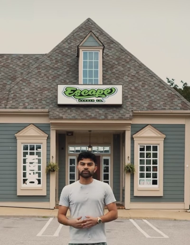 Andersson, owner of Escape Barber Co., outside the shop.